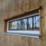Långsmalt fönster med droppnäsa av trä och aluzinkbleck.